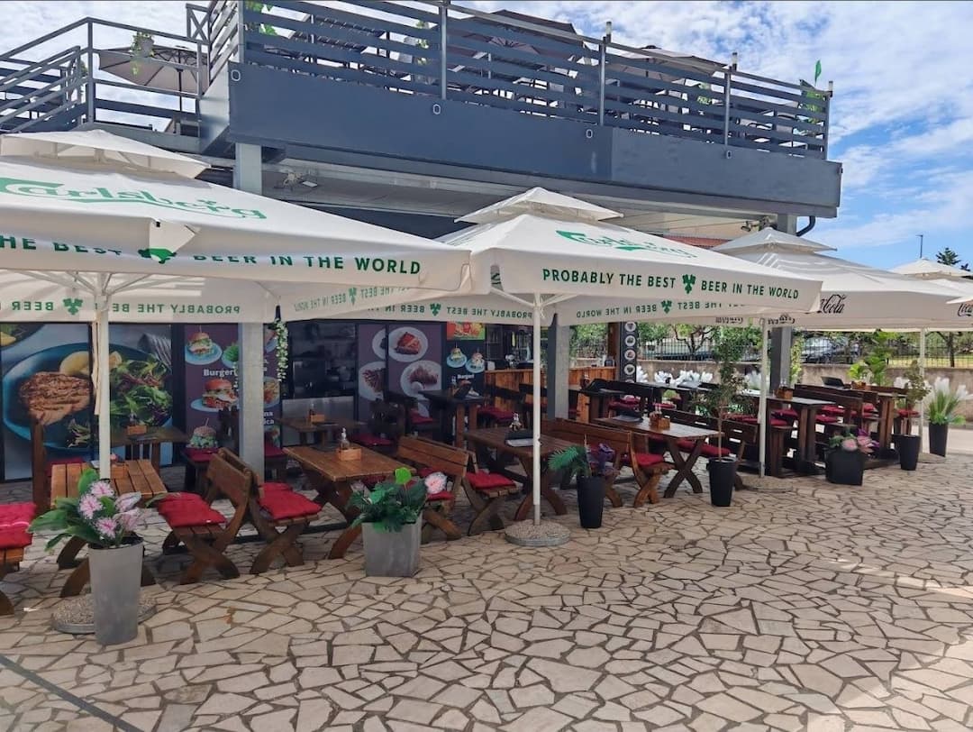 Outdoor seating terrace at Deluxe Grill and Pancakes Bar